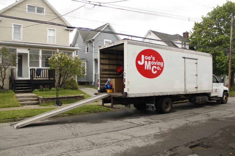 Joe's Moving Co. truck and crew at a Rochester, NY home